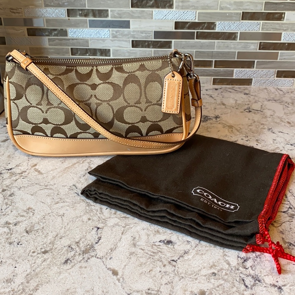 Coach Signature Swinger Purse.